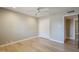 Bedroom featuring wood floors, a ceiling fan, and a closet at 3138 N 82Nd Pl, Scottsdale, AZ 85251