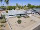 Charming home featuring desert landscaping, mature trees, and a gray exterior at 3138 N 82Nd Pl, Scottsdale, AZ 85251