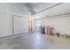 This well-lit garage has an interior door, ample storage space, and a clean, functional area for vehicles and projects at 3138 N 82Nd Pl, Scottsdale, AZ 85251