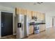Bright kitchen featuring stainless steel refrigerator and range at 3138 N 82Nd Pl, Scottsdale, AZ 85251