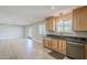 Kitchen showing light cabinets and stainless steel dishwasher at 3138 N 82Nd Pl, Scottsdale, AZ 85251