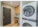 The laundry area features a stacked washer and dryer and extra storage at 3138 N 82Nd Pl, Scottsdale, AZ 85251