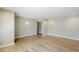 Spacious living area featuring neutral walls, hardwood floors, modern recessed lighting, and a large entry way at 3138 N 82Nd Pl, Scottsdale, AZ 85251
