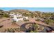 Desert property boasting mountain views, circular driveway, and native landscaping at 3333 N 87Th St, Mesa, AZ 85207
