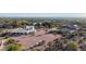 Expansive desert home featuring a circular driveway, mature desert landscaping, and mountain views at 3333 N 87Th St, Mesa, AZ 85207