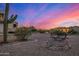 Desert landscaping, a bridge, and mountain views make this home an outdoor oasis at 3333 N 87Th St, Mesa, AZ 85207