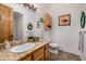 Well-lit bathroom featuring a granite countertop, framed mirror and coordinated decor at 3333 N 87Th St, Mesa, AZ 85207