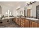 Bathroom features granite countertop vanity, double sinks, tub and decorative tile surround at 3333 N 87Th St, Mesa, AZ 85207