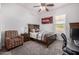 Comfortable bedroom features a ceiling fan and a large picture window with desert views at 3333 N 87Th St, Mesa, AZ 85207
