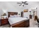 A bedroom featuring wood-look floors and a dresser visible through an open doorway at 3333 N 87Th St, Mesa, AZ 85207
