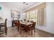 Dining room with large window, chandelier and seating for six people at 3333 N 87Th St, Mesa, AZ 85207