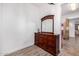 Close-up shot of a wood dresser with a decorative mirror in an empty room at 3333 N 87Th St, Mesa, AZ 85207