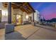 Charming Southwestern entrance with a covered porch, colorful stained glass, and outdoor seating area at 3333 N 87Th St, Mesa, AZ 85207