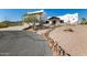 Beautiful Southwestern home with a desert landscape, long driveway, and charming illuminated walkway to the entrance at 3333 N 87Th St, Mesa, AZ 85207