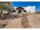 Charming stucco home featuring desert landscaping and a covered entryway with decorative details at 3333 N 87Th St, Mesa, AZ 85207