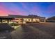 The back exterior of the home is perfect for entertaining with ample space, patio and landscaping at 3333 N 87Th St, Mesa, AZ 85207