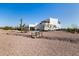 Desert property showcasing native plants, a recreational vehicle and ample parking at 3333 N 87Th St, Mesa, AZ 85207