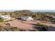 Stunning white home featuring an attached RV garage, desert landscaping, and mountain views at 3333 N 87Th St, Mesa, AZ 85207