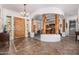 Open-concept foyer with unique architectural details, tile flooring, and a charming archway at 3333 N 87Th St, Mesa, AZ 85207