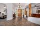 Spacious foyer with decorative tile flooring, statement front door, and elegant chandelier at 3333 N 87Th St, Mesa, AZ 85207