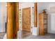 Bright foyer featuring a wood door, log beam supports, and stylish tile flooring at 3333 N 87Th St, Mesa, AZ 85207