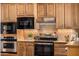 Close-up of modern kitchen appliances, including stainless oven and black microwave at 3333 N 87Th St, Mesa, AZ 85207