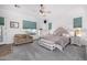 Spacious main bedroom features a decorative fan, sitting area and a tufted headboard at 3333 N 87Th St, Mesa, AZ 85207
