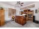 Cozy office with custom wooden desk, built-in bookshelves, and soft carpet flooring at 3333 N 87Th St, Mesa, AZ 85207