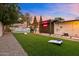 Spacious backyard featuring lush artificial turf, a pergola, and dedicated games area at 4020 N 34Th St, Phoenix, AZ 85018