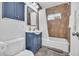 Well-lit bathroom featuring a vanity with modern fixtures, a tiled shower-tub combo, and neutral décor at 4020 N 34Th St, Phoenix, AZ 85018