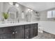 Stylish bathroom featuring a double vanity, modern fixtures, large mirrors and subway tile at 4020 N 34Th St, Phoenix, AZ 85018