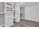 Bright, organized walk-in closet featuring custom shelving and drawers, and a modern design at 4020 N 34Th St, Phoenix, AZ 85018