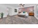 Spacious main bedroom with patterned accent wall, ceiling fan, wood-look floors and a walk-in closet at 4020 N 34Th St, Phoenix, AZ 85018