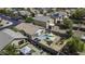 A bird's eye view shows the backyard oasis with a private pool, seating, and outdoor living spaces at 40845 W Thornberry Ln, Maricopa, AZ 85138