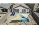 A backyard featuring a refreshing pool, shaded seating area and an outdoor living space at 40845 W Thornberry Ln, Maricopa, AZ 85138