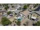 Aerial view showcasing the private backyard with a sparkling pool and shaded seating area at 40845 W Thornberry Ln, Maricopa, AZ 85138