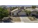 Aerial view of a single-story home with a two-car garage and desert landscaping at 40845 W Thornberry Ln, Maricopa, AZ 85138