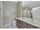 Bathroom with a double vanity, a toilet, and a shower at 40845 W Thornberry Ln, Maricopa, AZ 85138