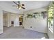 Bedroom with a ceiling fan, natural light, and a plant shelf accent at 40845 W Thornberry Ln, Maricopa, AZ 85138