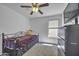 Cozy bedroom features a plush bed, dresser, and a ceiling fan at 40845 W Thornberry Ln, Maricopa, AZ 85138