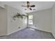 Cozy bedroom with a ceiling fan, natural lighting, and neutral walls at 40845 W Thornberry Ln, Maricopa, AZ 85138