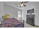 Bedroom with carpet, bed, ceiling fan, and a window at 40845 W Thornberry Ln, Maricopa, AZ 85138