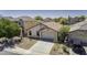 Charming single-story home with a well-maintained front yard, spacious driveway, and attached garage at 40845 W Thornberry Ln, Maricopa, AZ 85138
