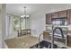 Kitchen with granite countertops, stainless steel appliances, and an eat-in breakfast nook at 40845 W Thornberry Ln, Maricopa, AZ 85138