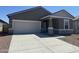 Charming single-story home showcasing a well-maintained front yard, concrete driveway, and attached two-car garage at 4213 E Kolin Ln, San Tan Valley, AZ 85143