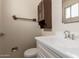 Bathroom featuring a toilet, sink, mirror, and cabinet at 4343 E Union Hills Dr, Phoenix, AZ 85050