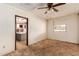 This cozy bedroom features a ceiling fan, window, and paneled walls for comfortable living at 4343 E Union Hills Dr, Phoenix, AZ 85050
