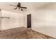 Bedroom featuring a ceiling fan, paneled walls, and plush carpet at 4343 E Union Hills Dr, Phoenix, AZ 85050