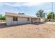 View of the back and side of the property shows low-maintenance landscaping and a covered patio at 4343 E Union Hills Dr, Phoenix, AZ 85050