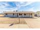 Charming single-story home with a low-maintenance gravel front yard and a covered carport at 4343 E Union Hills Dr, Phoenix, AZ 85050